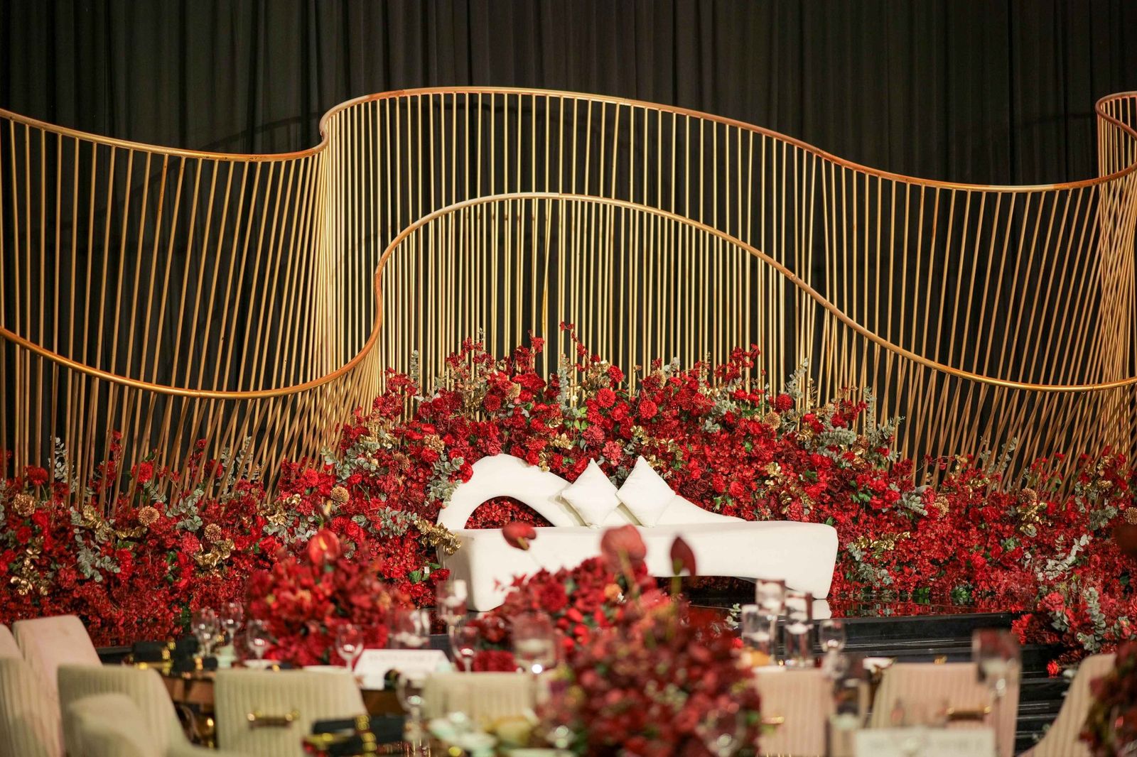 Gold mandap with red roses